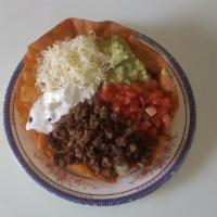 Taco Salad · Your choice of meat, lettuce, tomato, rice, beans, cheese, guacamole & sour cream.