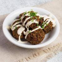 Green Herb Falafel · Five falafel balls topped with tahini and parsley (gf, v)