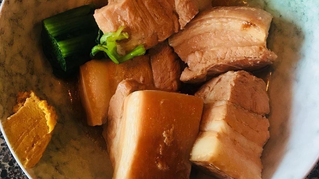 Braised Pork Belly (Kakuni) · Sweet soy braised pork belly 5 pcs, 1/2 soft boiled egg, and green onion.