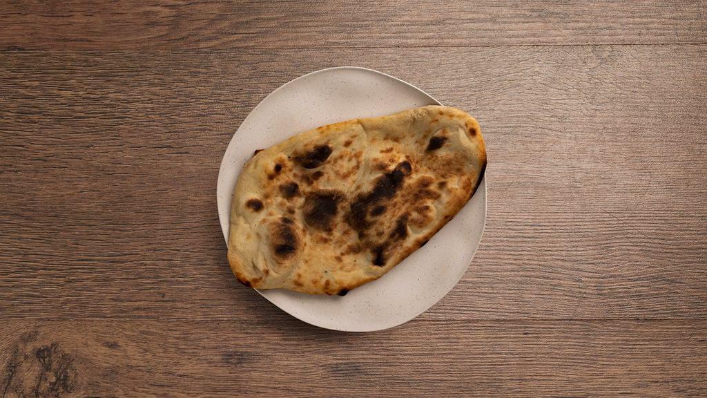 Cheese Naan · Oven-baked flatbread topped with cheese.