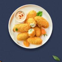 Just The Jalapeno Poppers · Fresh jalapenos coated in cream cheese and fried until golden brown.