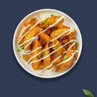 Wedges to Betsy · Thick-cut Idaho potato wedges fried and topped with bacon, cheddar cheese, smoked paprika, s...