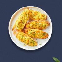 Cheesy Garlic Bread Syndrome · Toasted bread, butter, garlic, mozzarella cheese, and parsley.