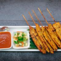 Satay · Skewered sliced chicken marinated in coconut milk and Thai spices, served with peanut sauce ...