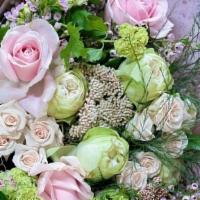 Hand-Tied Bouquet · Designer’s choice assorted flowers and greenery.