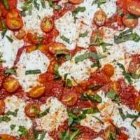Margherita · Fresh Mozzarella, Grape Tomatoes, Fresh Basil, Romano Cheese & Garlic Oil