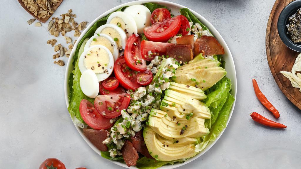 Hobb's Cobb Salad · (Vegetarian) Romaine hearts, blue cheese, bacon, hard-boiled pastured egg, avocado, and tomato tossed with vinaigrette dressing.