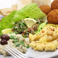 Falafel Plate · 6 pieces falafel served with Lettuce, tomato, pepperoncini, turnip rose pickles, tahini sauc...
