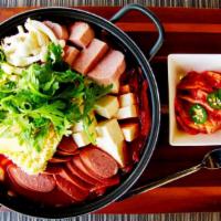 Spam Budae Jjigae · Spicy. Served with two bowls of rice and included ramen and American cheese.