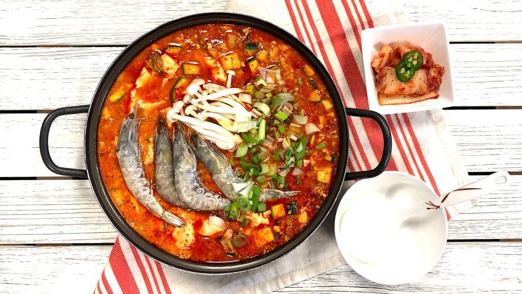 Seafood Soft Tofu Soup · Served with two bowls of rice. Add Extra Ramen for an additional charge.