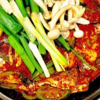 Kimchi Mackerel Pike Stew · Spicy. Served with two bowls of rice
