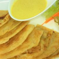 Roti with Curry · Thai pancake served with mild yellow curry sauce.