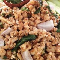 Larb Chicken · Ground chicken salad tossed with onion, cilantro, mint, roasted rice powder with chili lime ...
