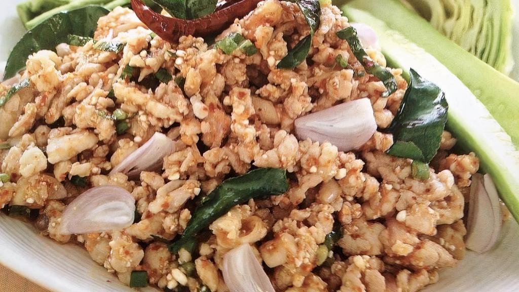 Larb Chicken · Ground chicken salad tossed with onion, cilantro, mint, roasted rice powder with chili lime dressing