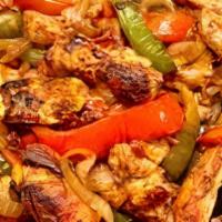 1. Fajitas · Peppers & onions choice of meat or mix, served with rice and beans guacamole and tortillas. ...