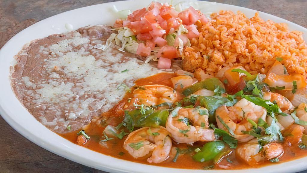 4. Shrimp Ranchero · Cooked with onions,tomatoes,bell pepper served with rice and beans and tortilla.