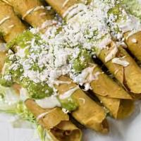 2. Flautas · Tortilla stuffed with potatoes and chicken and fried served with rice and beans, guacamole, ...