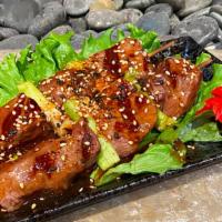 Beef Kushiyaki · Grilled skewered beef & scallions with teriyaki sauce