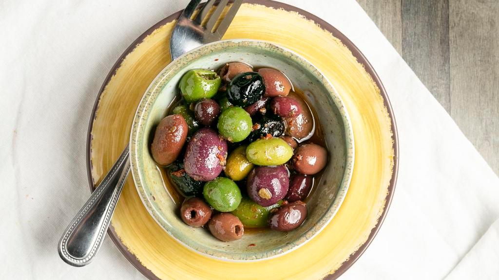 Mixed Olives · Vegetarian. Green and black olives infused with red peppers and a hint of chili.