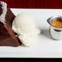 Chocolate Cake · House made chocolate cake with vanilla bean ice cream, whipped cream, and a warm house made ...