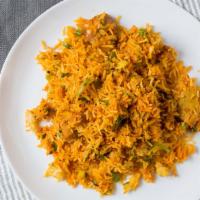 Chicken Biryani · Boneless spiced chicken cooked with basmati rice, onions, bell pepper and nuts.