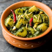 Aloo Palak · Delicious spinach and potatoes cooked with ginger and garlic.