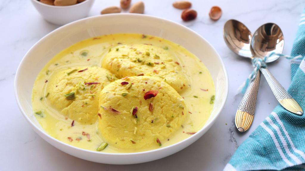 Rasmalai · Delicious dessert made of white cream, sugar, milk, and the cardamom-flavored paneer of chhana.