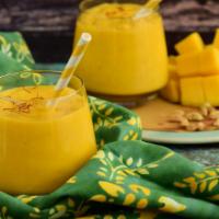 Mango Lassi · Fresh mango pulp with yogurt and sugar.