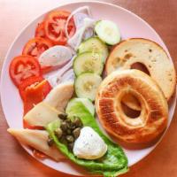 Fresh Baked Bagels · With Smoked Trout, Cream Cheese, Cucumbers, Shallots, Capers, Tomato