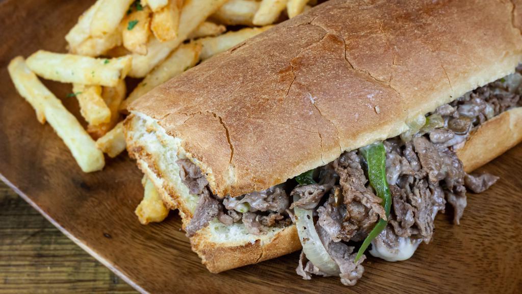 Philly Cheese Steak · Your choice of chicken or shredded beef, mushrooms, green peppers and onions topped with melted swiss cheese and served on a French roll.