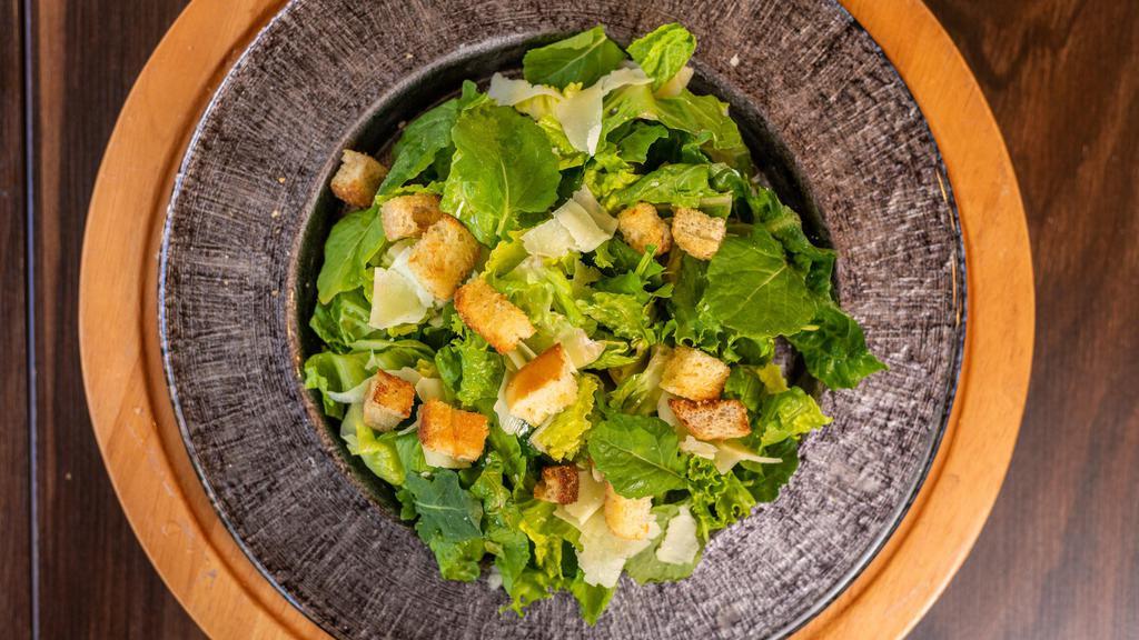 Kale Caesar · Mixed baby kale and romaine, croutons, parmesan cheese, Caesar dressing.