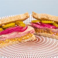 Pastrami · Hot pastrami with melted reserve Swiss cheese, whole grain mustard, pickles, pickled red oni...
