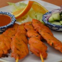Soy Protein Satay (Vegetarian) · Tasty marinated soy protein on skewers. Served with cucumber salad and our peanut sauce.