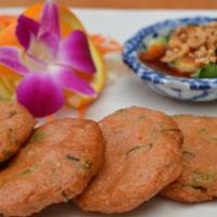 Fish Cakes · Deep-fried fish cakes consisting of green beans and a curry-based mix. Served with special p...