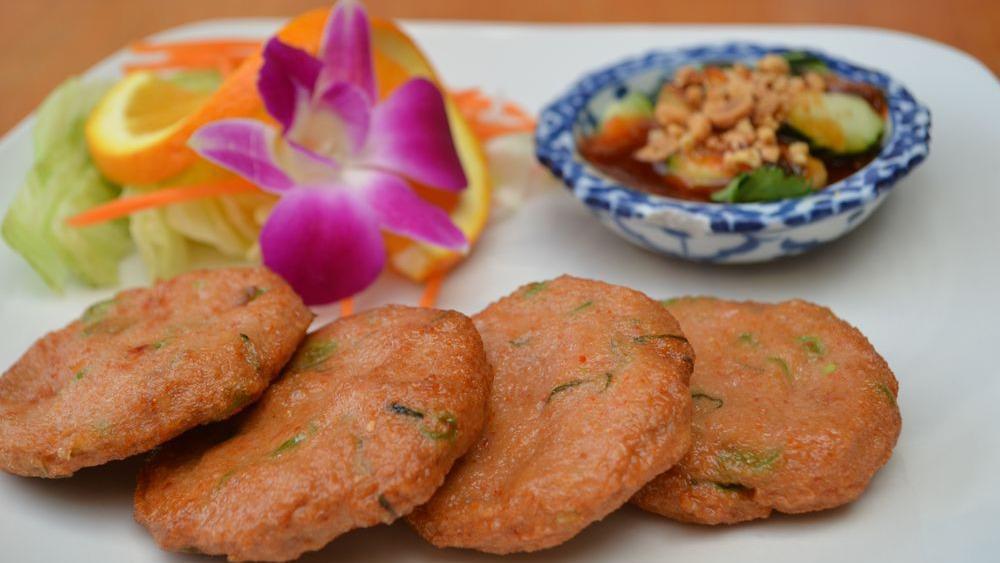 Fish Cakes · Deep-fried fish cakes consisting of green beans and a curry-based mix. Served with special plum sauce.