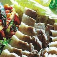 18. Dae Ji Bo Ssam · Steam pork with kimchi.