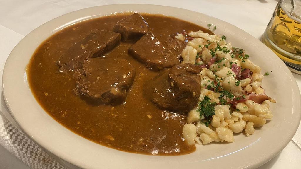Hungarian Goulash · Choice beef chunks cooked in paprika sauce and spaetzle.