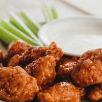 Boneless Wings (6) · Juicy boneless chicken served with your choice of sauce, dip & celery.