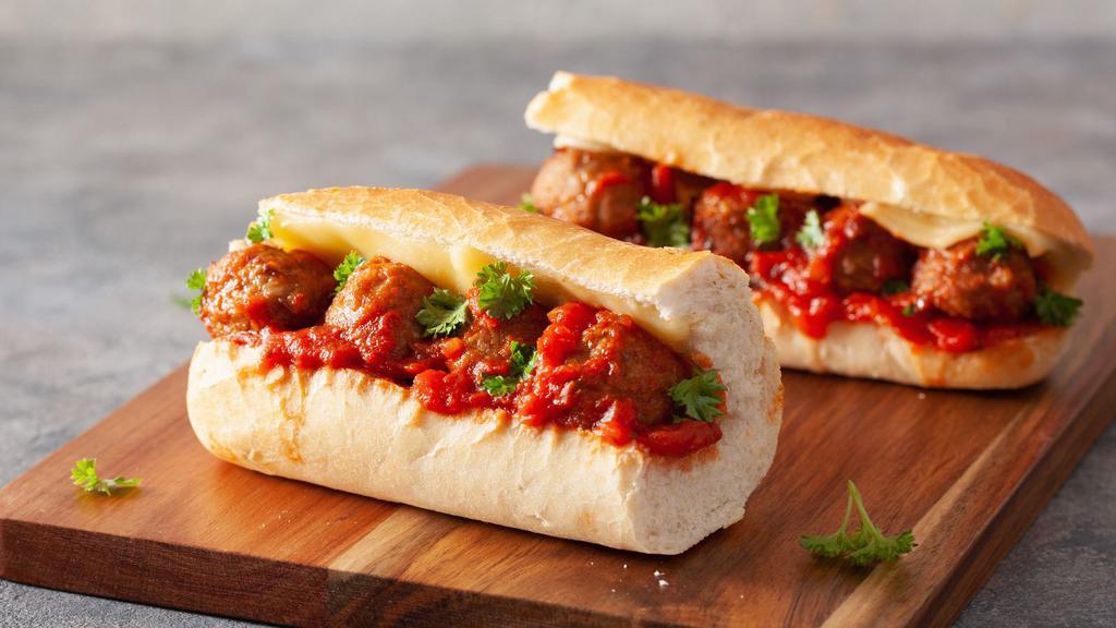 The Meatball Marinara Sandwich · Fresh sweet bread roll topped with meatballs and marinara sauce with provolone cheese.