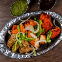 Samraat’s Tandoori Grill Special · 2pcs reshmi tikka, 2pcs chicken tikka, 1 chicken seekh kabob and 1 chicken leg.