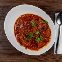 Lamb Masala · Meat. Boneless lamb cooked with sliced onion, bell pepper, tomato and cilantro.