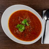 Mutton Masala · Goat meat cooked with onion and tomato based gravy.