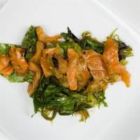 Salmon Poki Salad · Fresh maguro salmon, seaweed salad, organic spring mix, sliced jalapeño, tossed with housema...