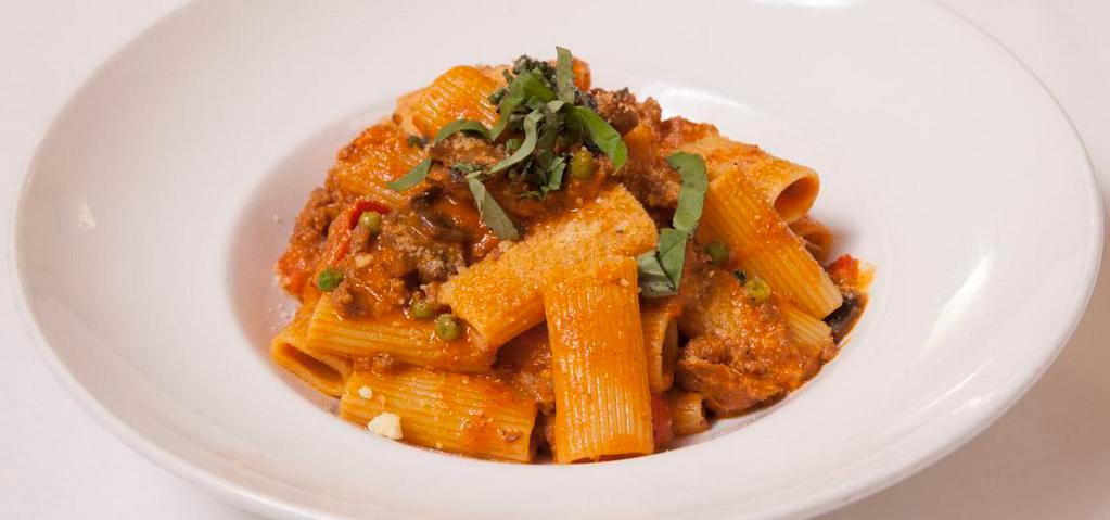 Rigatoni Rustica · Tube-shaped pasta with ground sausage, bell peppers, green peas, and mushrooms, in a tomato cream sauce.