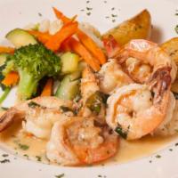 Gamberoni limone · Sautéed tiger prawns in a lemon butter sauce served with veggies and roasted potatoes
