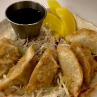 Gyoza · Vegetable. Meat or vege pot stickers, 5 pieces.