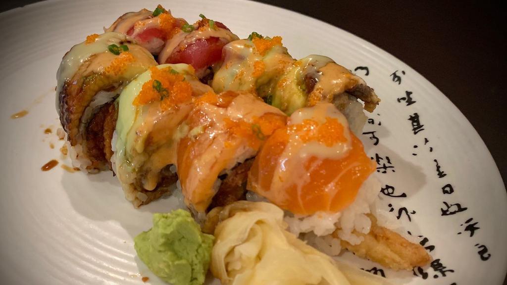 Gogo · Shrimp tempura, spicy tuna, cucumber, avocado topped with tuna, salmon and unagi.