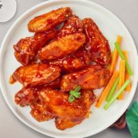 Mango Habanero Wings · Fresh chicken wings breaded, fried until golden brown, and tossed in mango habanero sauce.