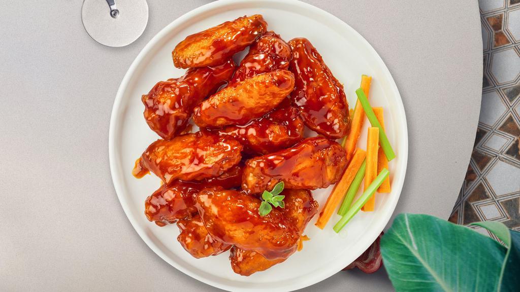 Mango Habanero Wings · Fresh chicken wings breaded, fried until golden brown, and tossed in mango habanero sauce.