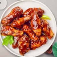 BBQ Baby Wings · Fresh chicken wings breaded, fried until golden brown, and tossed in barbecue sauce.